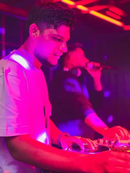 A candid shot of me and a fellow DJ mixing together at Gawky Goose.