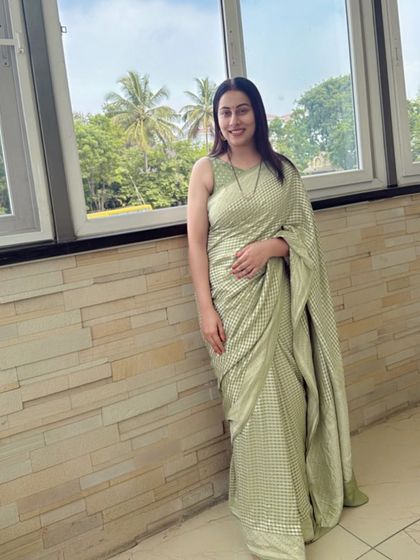 Dr. Shruthi redefines modern grace in our pastel green Banarasi silk, a soft statement of power and poise.