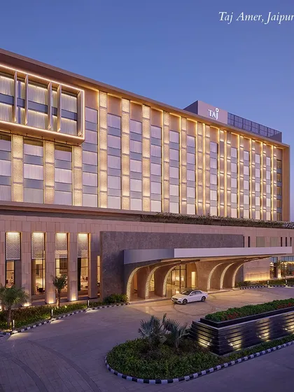 The modern and stylish exterior of the Taj Amer in Jaipur. This hotel offers a contemporary take on luxury in the historic Pink City.
