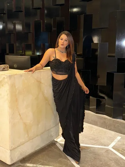 Posing at the hotel lobby before heading to host a wedding event.