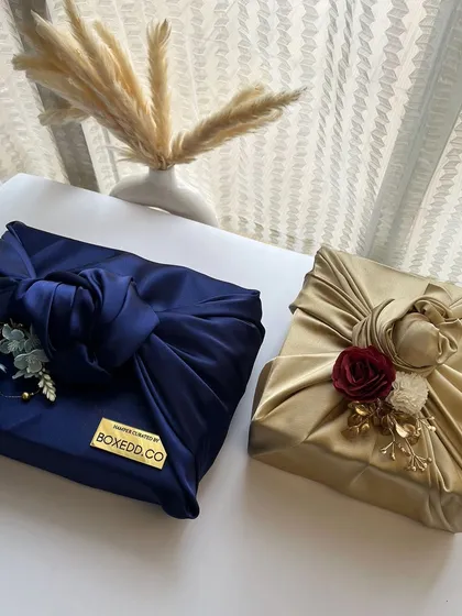 I love using fabric wrapping, or Furoshiki, for a luxurious and sustainable packaging option. These are perfect for wedding invitations or elegant gifts.