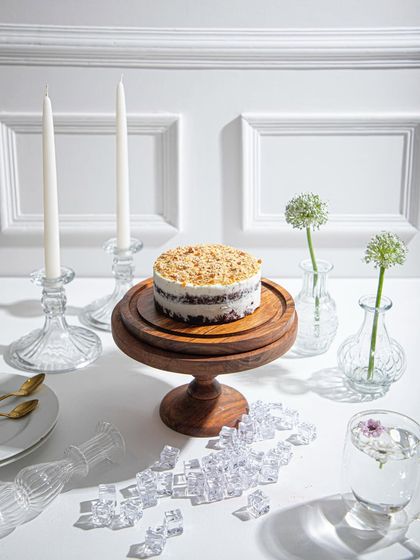 A wider view of our crumb-topped ice cream cake, set on a beautifully styled table. Ice cream cakes are always a good idea.