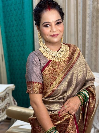 A smiling portrait of the mother, looking graceful and radiant.