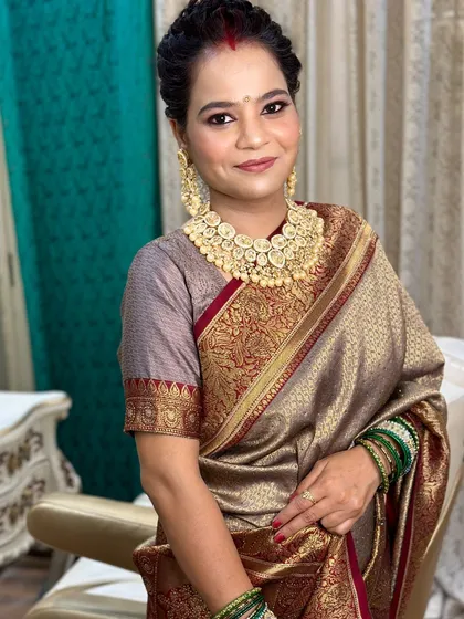 A smiling portrait of the mother, looking graceful and radiant.