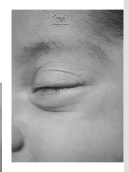 An artistic close-up of a newborn's eye in black and white. These detailed shots are a beautiful complement to a full newborn gallery.