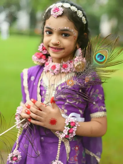I love bringing creative ideas to life, like this beautiful portrait of a young girl dressed as Radha for Janmashtami. The detailed costume, floral jewelry, and peacock feather create a truly special festive photograph.