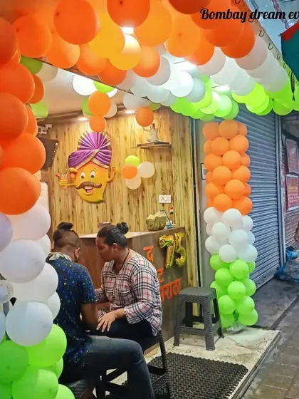 This street-side food stall is ready for Republic Day with a ceiling and pillar balloon decoration in saffron, white, and green, showing that any business can join in the celebration.