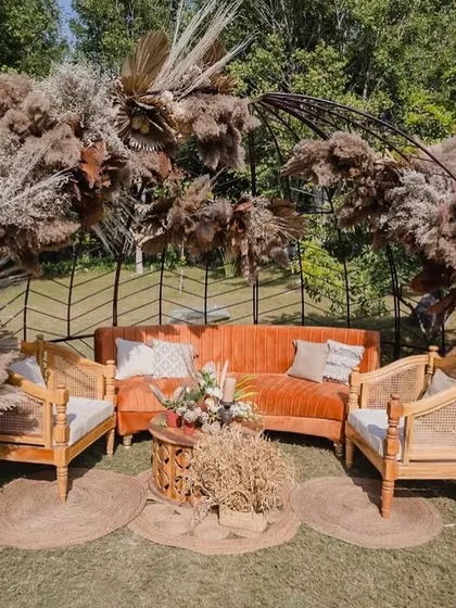 This minimal boho lounge is an example of our 'Wild & Warm' design style. We used earthy tones, pampas grass, and natural wood textures to create a soulful corner for quiet conversations and beautiful photo opportunities.