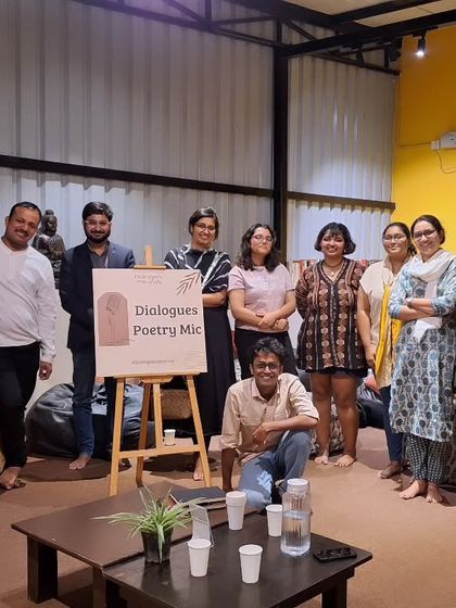 A group photo from our "Dialogues Poetry Mic," a community of poets and listeners who gather to share and appreciate the art of words.