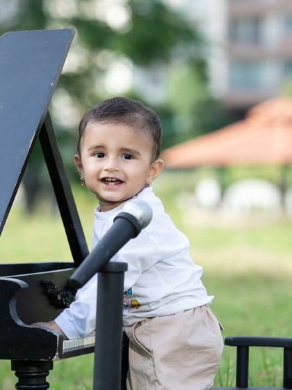 Another shot of our little performer, enjoying the fresh air and music.