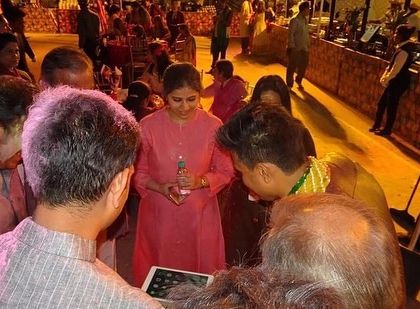 The best magic happens when everyone gathers around. In this moment, a group of guests watches intently as an illusion unfolds on my iPad. This type of strolling magic ensures that everyone at your event gets a front row seat to the action.