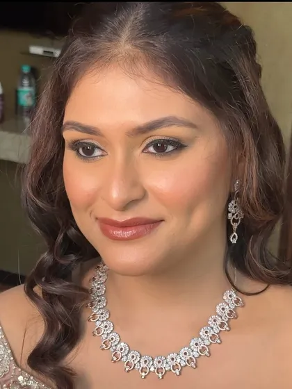 A portrait of the bride, her Sangeet glam looking perfect. The soft waves in her hair complement the romantic feel of the makeup.