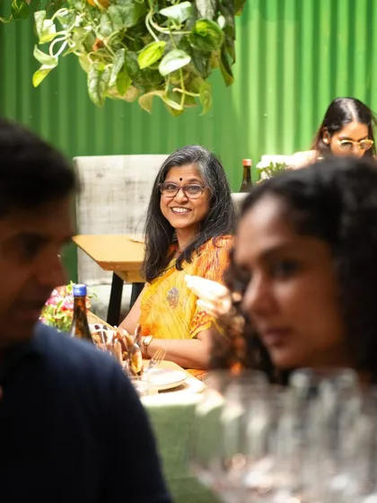 A happy guest enjoying the authentic Thai flavors from our Fireback restaurant pop-up. Our goal is to create memorable experiences where you can relax, enjoy great food, and feel part of a community.