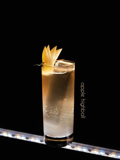 The Apple Highball is a crisp and effervescent drink. We combine the clean taste of apple with sparkling soda, garnished with a fan of fresh apple slices. It is a refreshing choice that highlights the fruit's natural brightness.