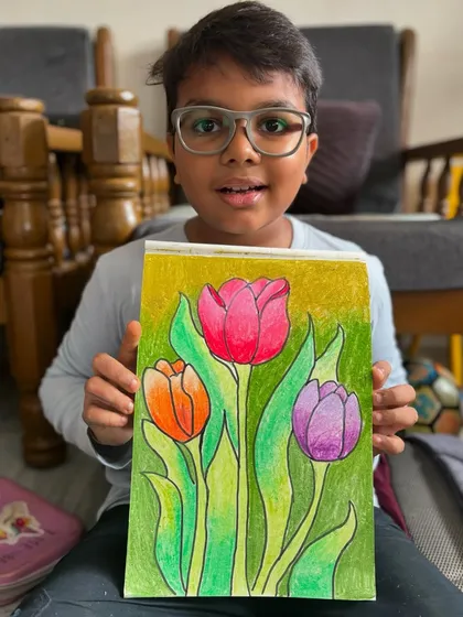 Another beautiful tulip drawing by a 5th-grade student, showcasing their ability to create depth and form with colour. I love seeing their skills blossom with each new project.