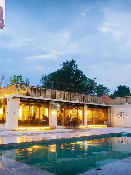 Welcome to your private escape. This is the view of Sasa Cafe from our poolside area at dusk, just as the lights start to create that magical glow. It’s a space I designed for you to leave the city chaos behind and just chill.