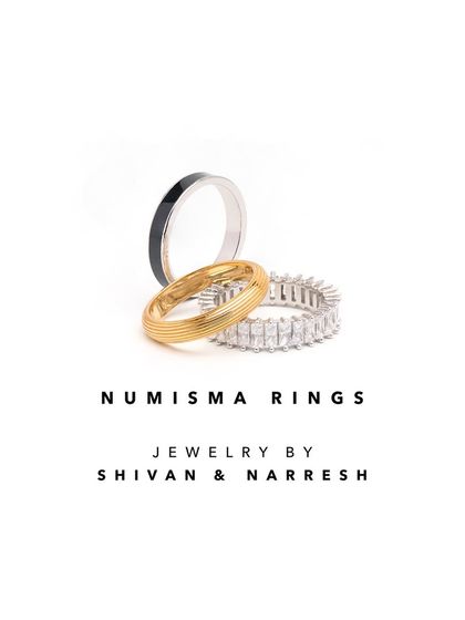 A product shot of the Numisma Rings stack. These rings are designed to be mixed, matched, and stacked, allowing you to create a personalized look that can be as minimal or as bold as you like.
