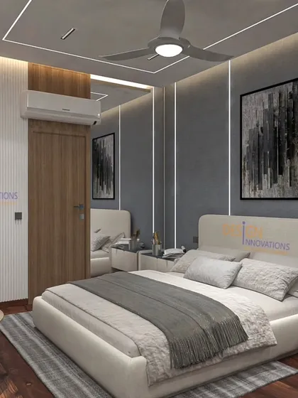 This master bedroom is a sanctuary of calm, designed with a sophisticated grey palette and warm wood flooring. We integrated custom backlit display cabinetry and layered lighting to create a mood that is both relaxing and elegant.