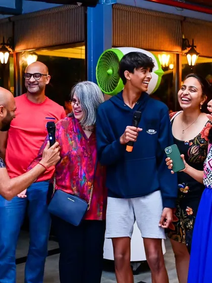 It's not just for the club crowd. I love hosting private events and bringing the karaoke fun to people of all ages. Here's a family celebrating together, proving that a good song can get anyone smiling and singing along.