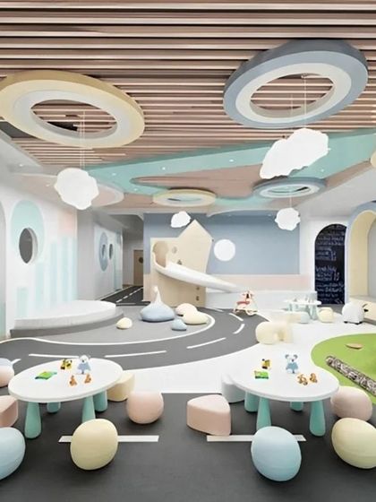 We designed this large space as an indoor play area with a road-themed floor, soft play elements, and creative cloud lighting, perfect for toddlers and young children.