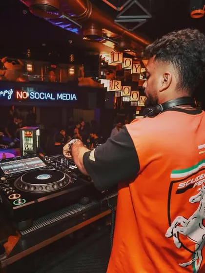 A shot from behind, showing my focus on the Pioneer DJ decks. The setup is my instrument for conducting the night's energy.