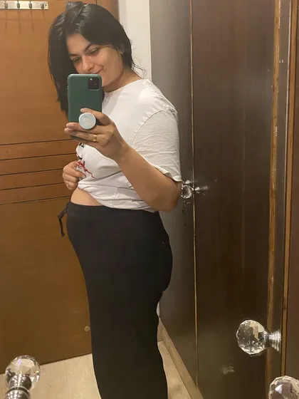 Another mirror selfie capturing my postpartum belly. It's a reminder of the starting point of my journey.