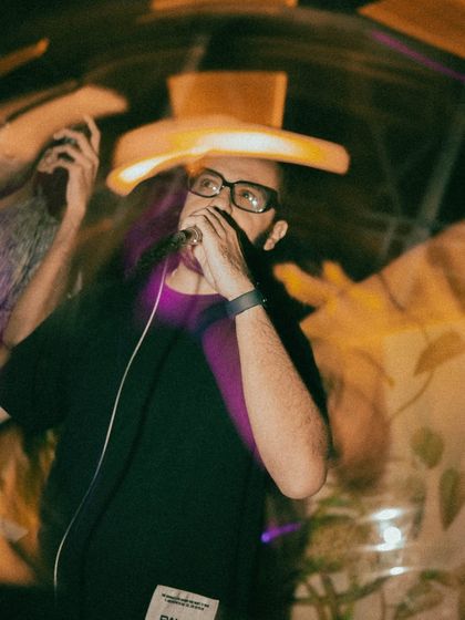 A close-up shot of me on the mic, fully locked in. Whether I'm DJing or MCing, my focus is always on controlling the sound and keeping the energy levels up.