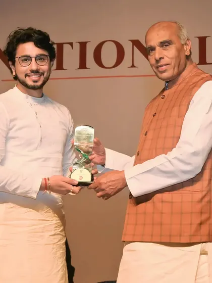 Receiving the trophy for the National Icon Award 2023. These symbols of recognition fuel my artistic journey.