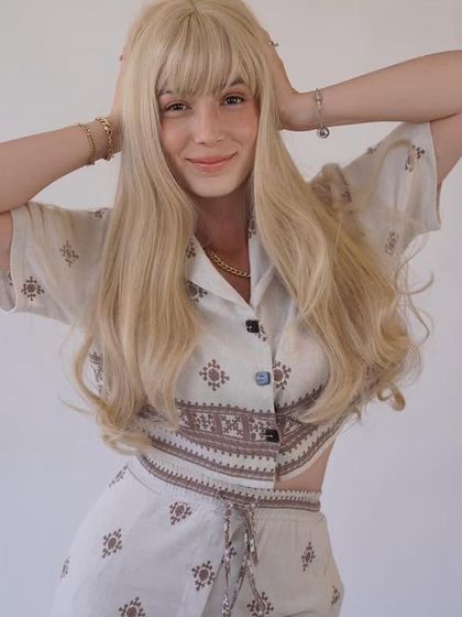 Another look at our stunning 50-inch blonde wig. The length and color are dramatic, but the human hair keeps it looking and feeling natural.