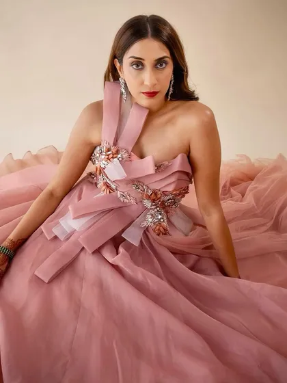 A closer look at this after-party glam. The flawless skin and striking red lip create a look that is both classic and modern, exuding confidence and elegance.