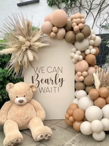 I love the simplicity and warmth of a boho baby shower. This 'We Can Bearly Wait' theme uses a neutral palette, an organic balloon garland, pampas grass, and a giant teddy bear for a chic and modern celebration.