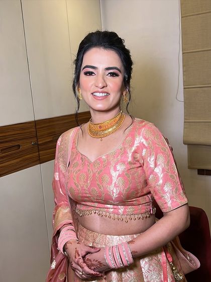 A front-facing view of this lovely reception makeup. The look is minimal yet polished, perfect for a post-wedding event.