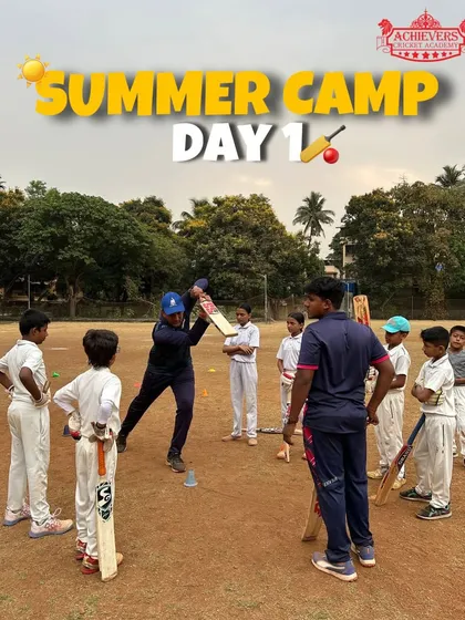 Day 1 of the Summer Camp! A coach demonstrates a batting technique to an eager group of new campers.