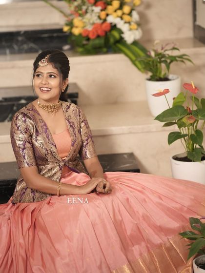 My beautiful client looks so charming in this custom housewarming outfit. I paired a flowing peach Kanchi-border skirt with a chic brocade jacket, blending traditional fabric with a modern, layered silhouette.