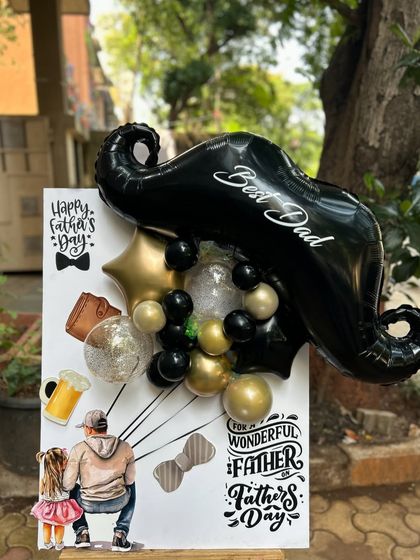 For the dad with swagger, this postcard features a large mustache-shaped balloon. The black, gold, and silver color scheme gives it a cool, modern vibe.