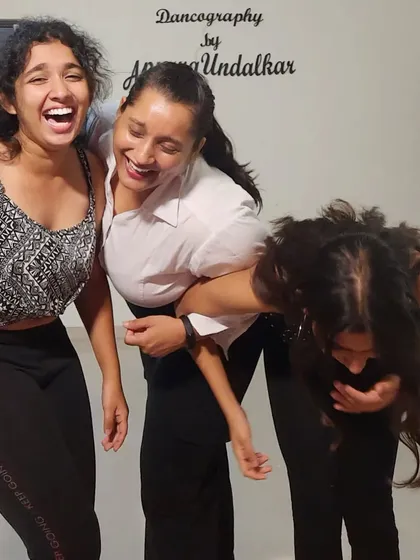 This picture says it all. My classes are a space for laughter, fun, and friendship. We work hard, but we also don't take ourselves too seriously. This is the kind of candid, happy energy you can expect when you join my dance family.