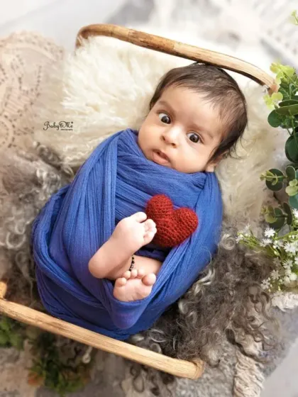 Those big, curious eyes are so captivating. Even when babies are swaddled, their expressive faces can tell a whole story.