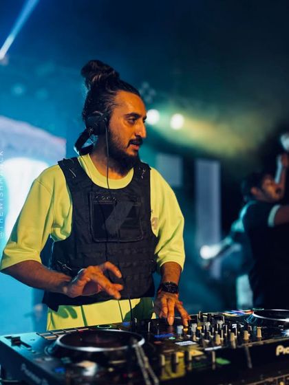 A duplicate of image 58, showing my concentration while mixing at the large-scale auto expo event in Kerala.