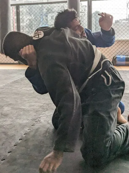 A close-up of a scramble during a Jiu Jitsu roll. These intense moments are where real learning and skill development happen.