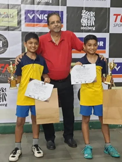 Our students with their coach after a successful run at the Smash Masters District Open Tournament. We secured titles in U9, U13, and U17 categories.