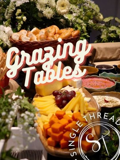 A graphic overlay on an image of a grazing table, highlighting the abundance and variety of the spread.