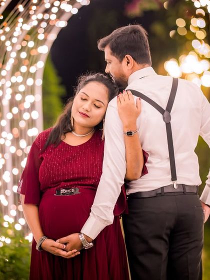 A quiet, tender moment for an expecting couple within the light tunnel, a perfect setting for a peaceful maternity photo.
