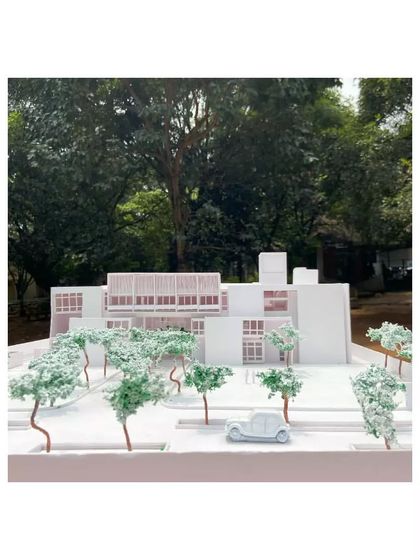 A physical model of the Brilliant National School, showing how the building is integrated with the landscape. The design includes numerous courtyards, green roofs, and outdoor learning spaces to connect students with nature.