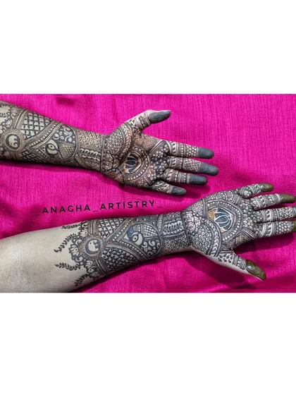 Another view of the intricate engagement mehendi. You can see how the patterns flow from the palm to the arm, creating a cohesive and stunning piece of art.