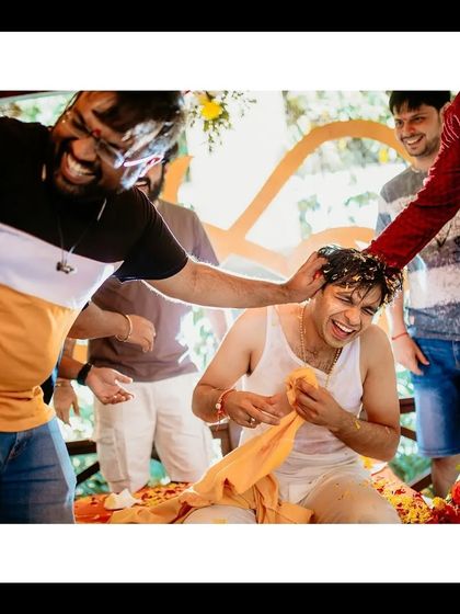 Friends and family having fun with the groom during the Haldi, a moment of pure celebration and friendly chaos.