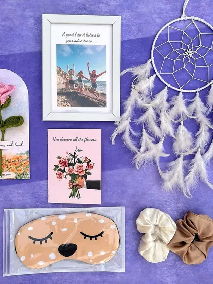 This 'Pastel Pamper Hamper' is the ultimate gift for a friend. It includes a custom photo frame, a dream catcher, a crochet rose, an eye mask, scrunchies, and a card.