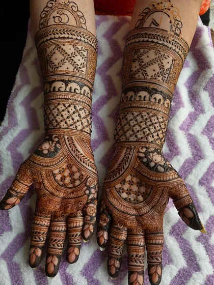 The full view of the engagement mehendi, with its intricate patterns and auspicious symbols. A perfect start to the wedding celebrations.