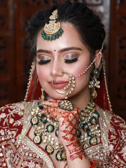 A beautiful shot of a bride with her eyes closed, highlighting the shimmery, glamorous eyeshadow.