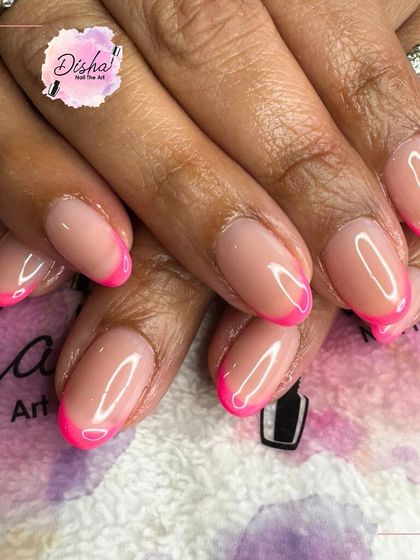 Sweet, simple, and a little sassy. Classic French tips in a vibrant, hot pink for a fun and modern take on a timeless style.