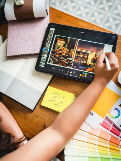 The tools of my trade. My desk is a mix of digital and analog, from an iPad for sketching and mood boards to physical planners and swatch books. This blend allows me to stay organized while keeping the creative process tactile and personal.
